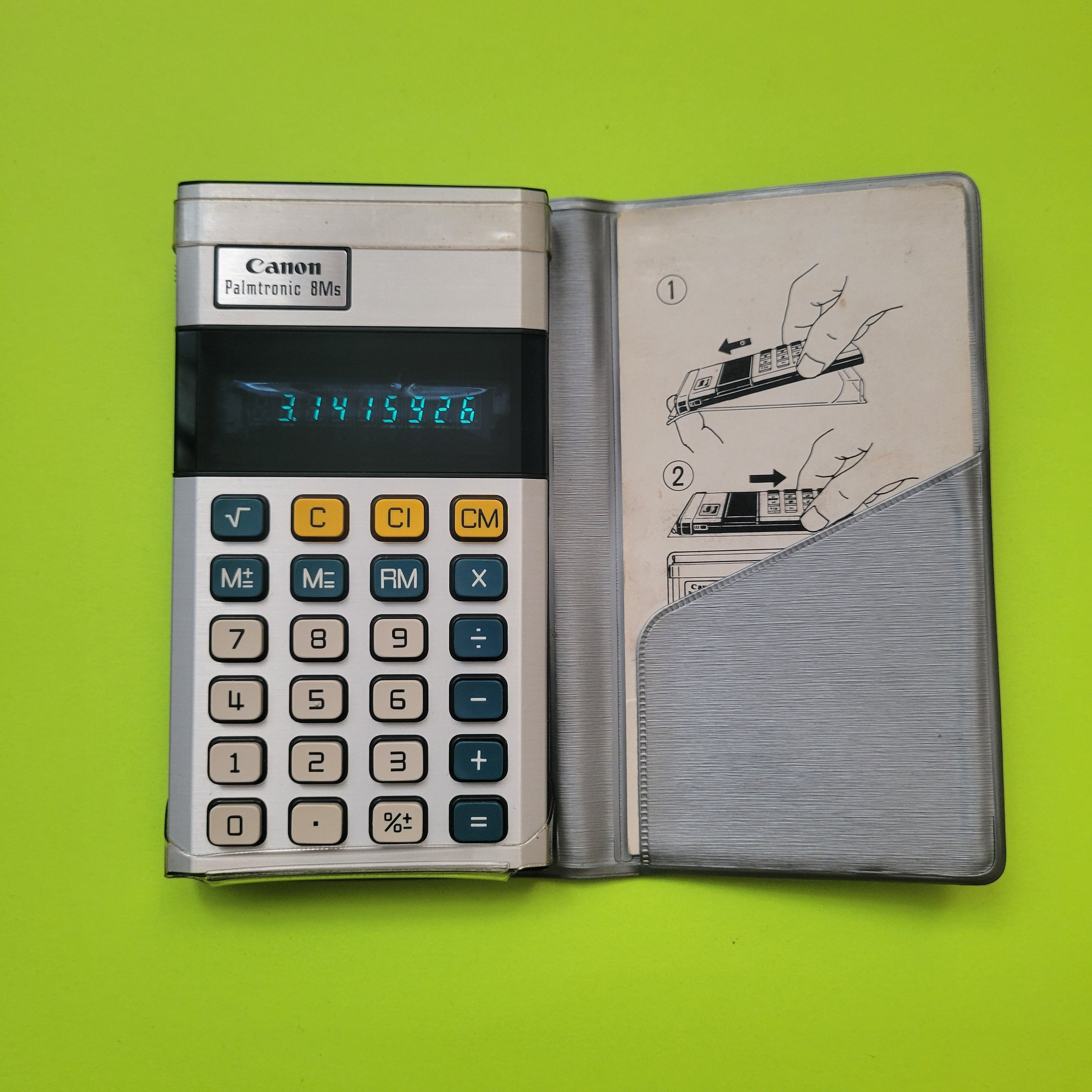 an image of a Canon Palmtronic 8Ms four function plus calculator